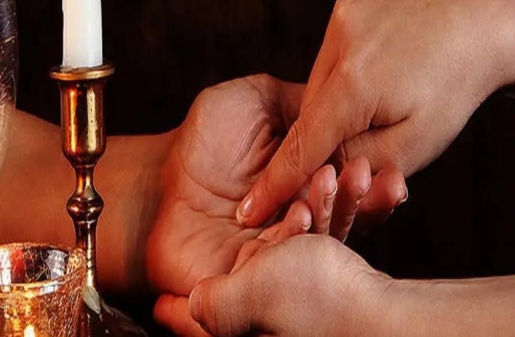 Palm reading by candlelight