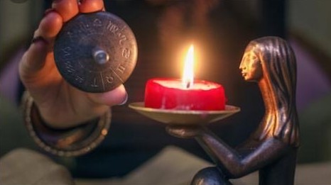 Engraved talisman and red candle
